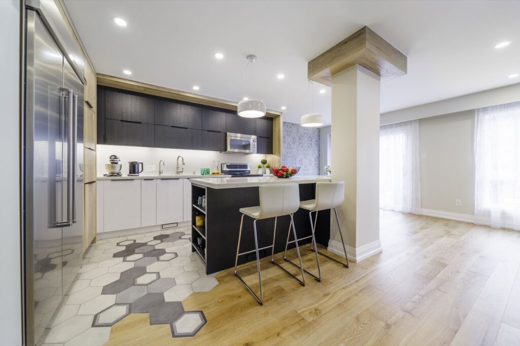 Completed Richmond Hill full-home renovation with an open kitchen, island, dining area and connected living space.