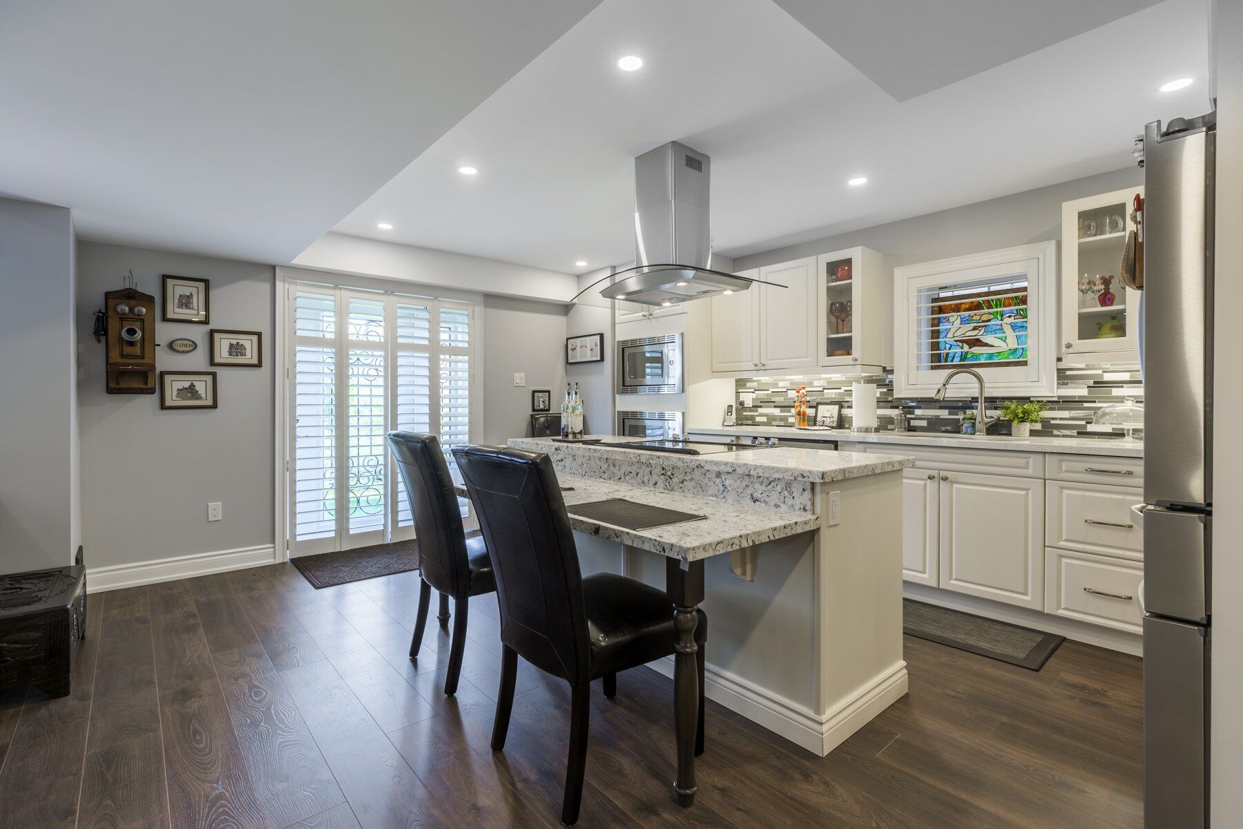 Kitchen island and adjoining living space in the Vaughan home renovation